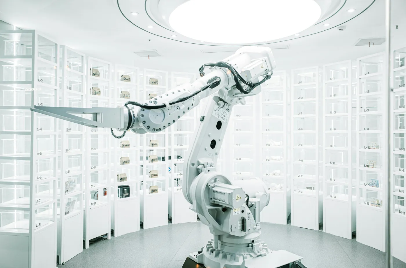 A robotic arm working inside an automated lab